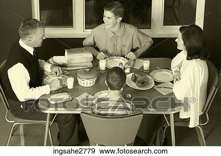 1950s family at dinner table View Large Photo Image Stock Photo - 1950s family at dinner table . Fotosearch