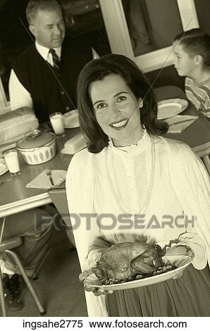 1950s family at dinner table View Large Photo Image Stock Photography - 1950s family at dinner table . Fotosearch