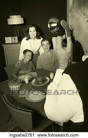 Stock Image - 1950s family taking picture . Fotosearch