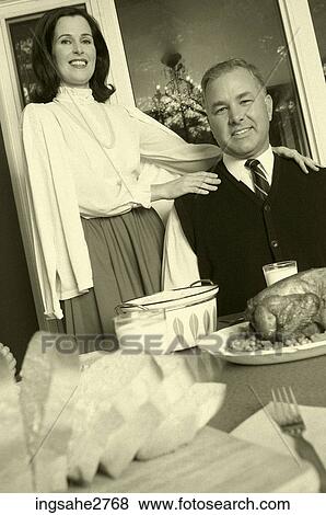 1950s Mature adult couple at dinner table View Large Photo Image Stock Photo - 1950s Mature adult couple at dinner table . Fotosearch