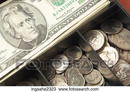 Stock Image - American currency in a tray a82. Fotosearch