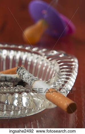 Burning cigarette and baby soother View Large Photo Image Stock Image - Burning cigarette and baby soother. Fotosearch