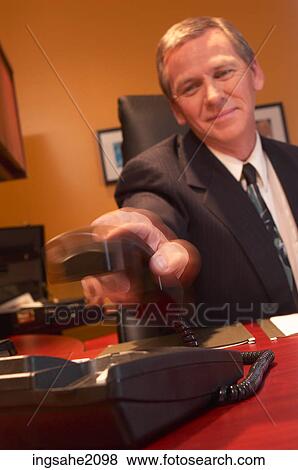 business man reaching for phone BE 2 View Large Photo Image Stock Photo - business man reaching for phone BE 2. Fotosearch