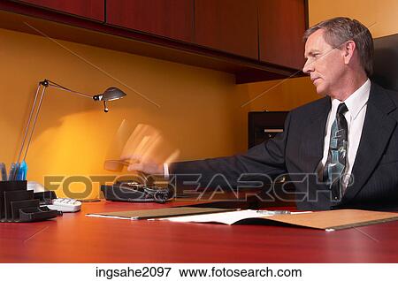 business man reaching for phone BE View Large Photo Image Stock Photo - business man reaching for phone BE. Fotosearch