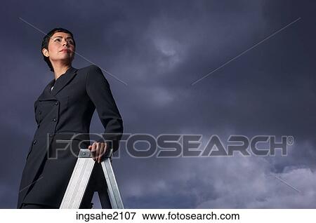 Stock Photo - business woman and ladder BE 7. Fotosearch
