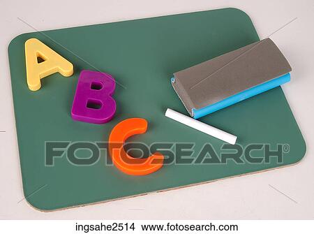 Picture - Chalk with eraser and letters . Fotosearch