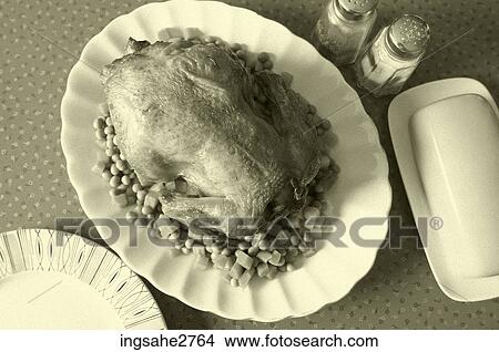 Picture - Chicken and peas . Fotosearch
