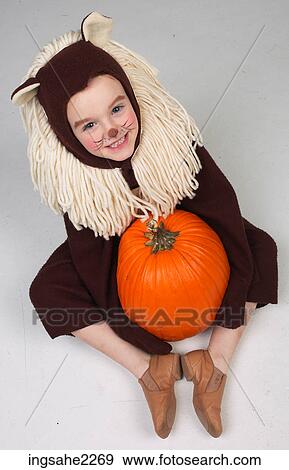 Stock Photo - Child dressed as lion . Fotosearch