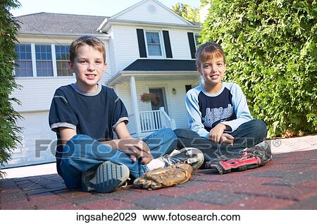 Children sitting in driveway BE 2 View Large Photo Image Stock Photo - Children sitting in driveway BE 2. Fotosearch