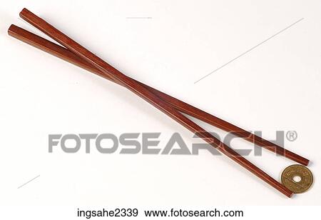 Chopsticks holding coin View Large Photo Image Stock Photo - Chopsticks holding coin . Fotosearch