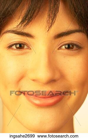 Stock Photo - Close up of woman's smiling face. Fotosearch