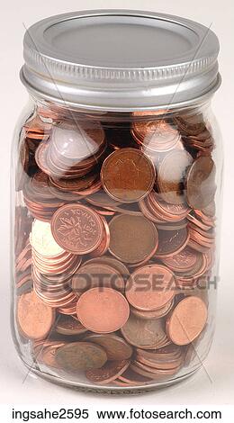 Stock Photography - Coins in a jar . Fotosearch