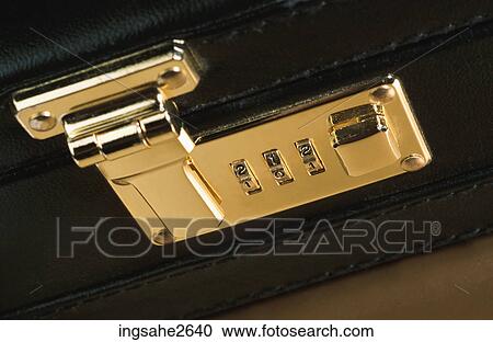 Stock Image - Combination lock on briefcase . Fotosearch