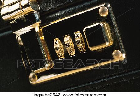 Stock Image - Combination lock on briefcase . Fotosearch