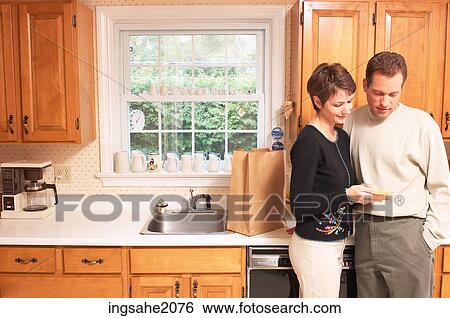 couple with grocery bill BE View Large Photo Image Stock Photograph - couple with grocery bill BE. Fotosearch