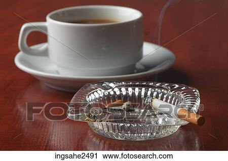 Cup of coffee and cigarette View Large Photo Image Stock Image - Cup of coffee and cigarette. Fotosearch