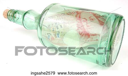 Stock Photo - Currency in a bottle . Fotosearch