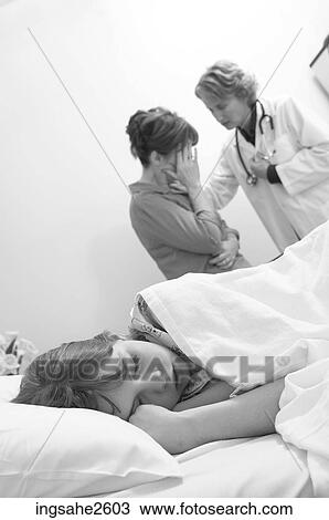 Doctor comforting patient's mother View Large Photo Image Stock Image - Doctor comforting patient's mother. Fotosearch