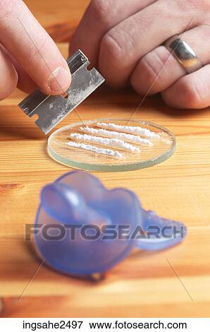 Drug paraphernalia and baby's soother View Large Photo Image Stock Photo - Drug paraphernalia and baby's soother. Fotosearch