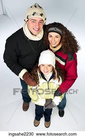 Stock Image - family dressed for winter . Fotosearch