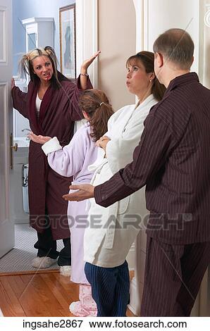 Stock Photo - Family lining up to use bathroom . Fotosearch