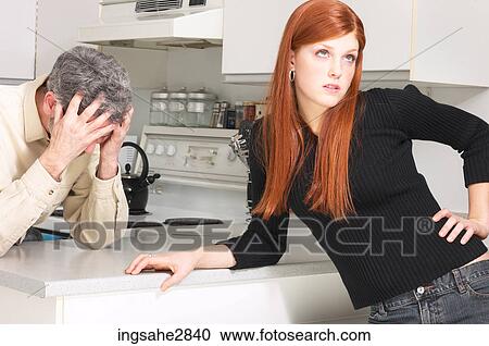 Father and daughter arguing in the kitchen View Large Photo Image Stock Image - Father and daughter arguing in the kitchen . Fotosearch