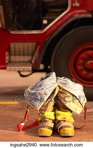 Firefighting gear with truck View Large Photo Image Stock Image - Firefighting gear with truck . Fotosearch
