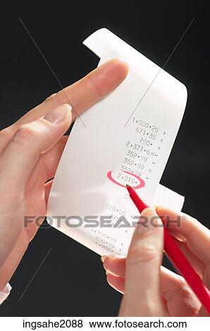 Stock Photo - hand circling receipt BE 1. Fotosearch