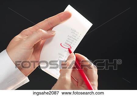 hand circling receipt BE View Large Photo Image Stock Photo - hand circling receipt BE. Fotosearch