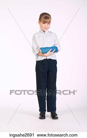 Little girl cradling broken arm View Large Photo Image Stock Image - Little girl cradling broken arm . Fotosearch