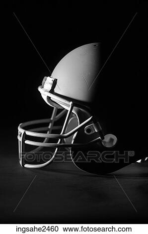 Stock Image - Lone football helmet with shadow . Fotosearch
