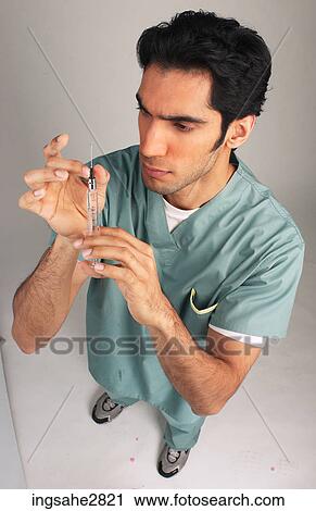 Stock Image - man in hospital scrubs . Fotosearch