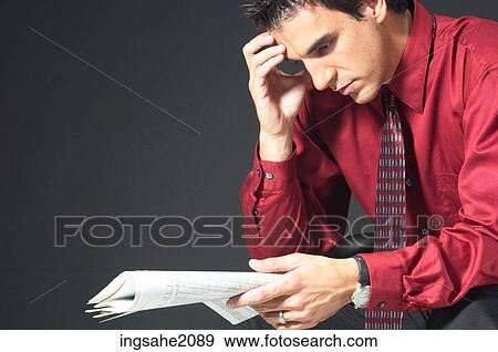 man reading stock quotes BE 2 View Large Photo Image Stock Photo - man reading stock quotes BE 2. Fotosearch