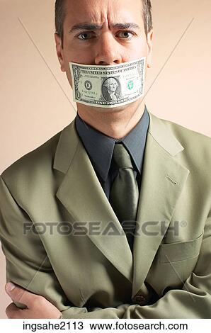 man with money over mouth BE 1 View Large Photo Image Stock Image - man with money over mouth BE 1. Fotosearch