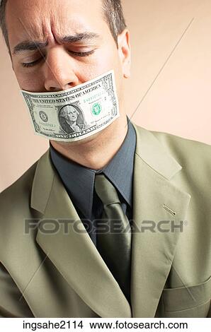 man with money over mouth BE 2 View Large Photo Image Picture - man with money over mouth BE 2. Fotosearch