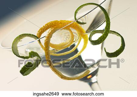 Martini with citrus twists View Large Photo Image Stock Photo - Martini with citrus twists. Fotosearch