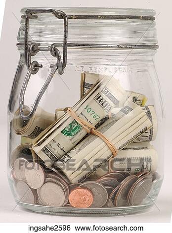 Stock Photograph - Money in a jar . Fotosearch