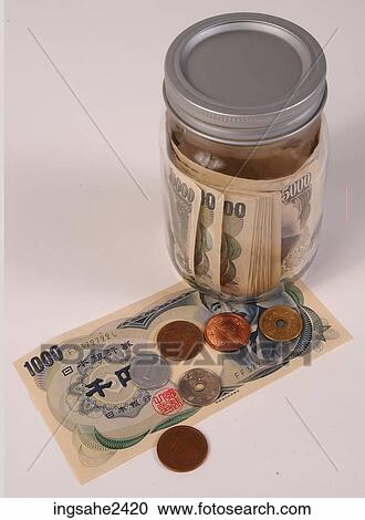 Stock Image - Money in glass jar . Fotosearch