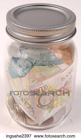 Stock Photo - Money in glass jar . Fotosearch