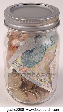 Money in glass jar View Large Photo Image Stock Photo - Money in glass jar . Fotosearch