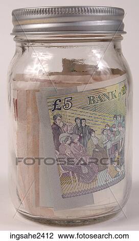 Stock Image - Money in jar . Fotosearch