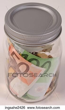 Stock Photograph - Money in jar . Fotosearch