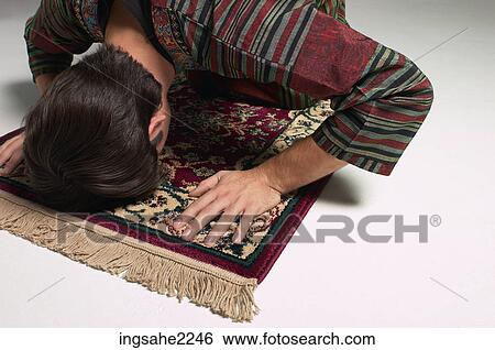 Muslim man at prayer View Large Photo Image Stock Photograph - Muslim man at prayer . Fotosearch