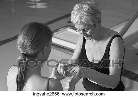 Stock Photograph - Patient undergoing water rehabilitation therapy. Fotosearch