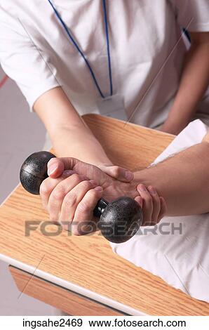 Patient using physical therapy equipment View Large Photo Image Stock Photo - Patient using physical therapy equipment . Fotosearch