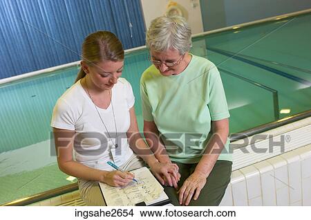 Patient with physiotherapist by pool an 3 View Large Photo Image Picture - Patient with physiotherapist by pool an 3. Fotosearch