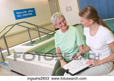 Patient with physiotherapist by pool an 2 View Large Photo Image Stock Image - Patient with physiotherapist by pool an 2. Fotosearch