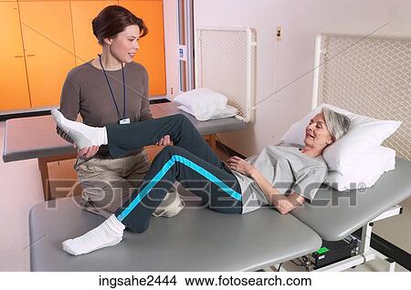 Picture - Patient with rehabilitation specialist . Fotosearch