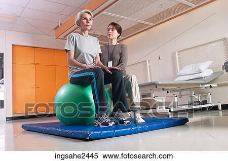 Patient with rehabilitation specialist View Large Photo Image Stock Photography - Patient with rehabilitation specialist . Fotosearch