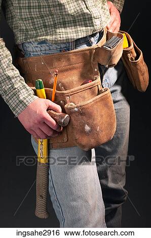 Stock Photograph - Person wearing jeans and tool belt . Fotosearch